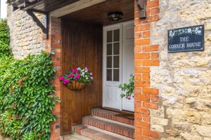 Front storm porch/nameplate- click for photo gallery